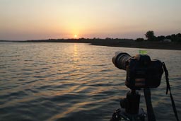 Fuji S3 Pro DSLR Camera with Nikon AFS 70-200 mm f/2.8 G ED-IF VR mounted on large Gitzo Tripot in Water in Buba Guinea Bissau