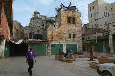 Hebron, Palestine, watch tower on top of old town, Jewish settlement right.