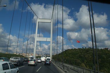 Fatih Sultan Mehmet Bridge over Bosporous. Turkish Flag on Aian side.