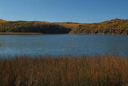 Crater Lake, reed, blue lake and sky, autumn. Turkey.