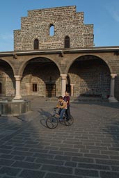 Aramaean church, boys on bycicle. Diyarbakir.