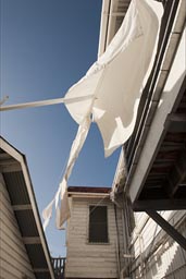 White sheets from laundry fly every day outside Isabel's guest house in Belize City..