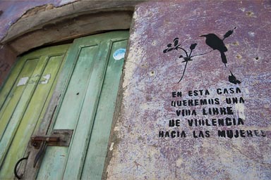 In this house we want a life free of violence against women. Sprayed on every other house in Suchitoto, El Salvador.  