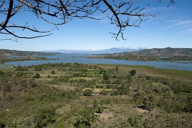 Lago Suchitoto, blue lake nested in surrounding hills. El Salvador.