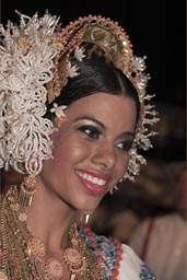 Most beautiful of the carnival queens, lots of gold around her neck. Las Tablas, Panama.