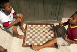 Playing checkers in Guna Yala, Island of San Ignacio.