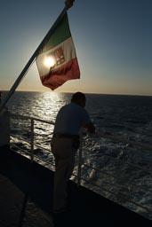 Ferry Trapani Sicily, Cagliary Sardinia, Italian Flag Man and Sea and Sun.