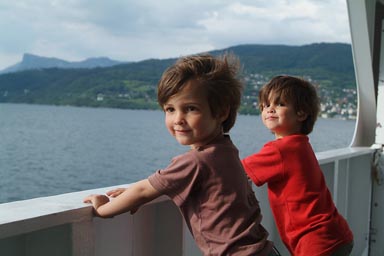 Boys looking over reiling, ferry Norway.