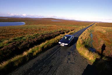 Morning in the moor, a car passing by