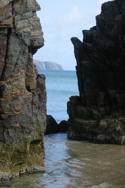 A view of the coast line through cliffs