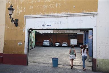 Girls enter garage, Guadalajara.