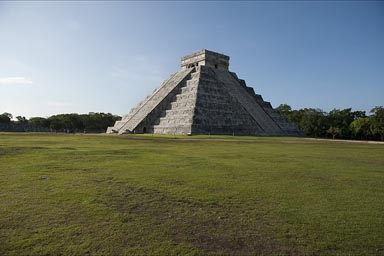 Chichen Itza, Great Pyramid. Early morning. View on the two restored sides, one in shade.