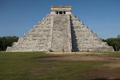 Front, west view of great pyramid, Chichen Itza, Yucatan. Watch the the snake like shape of the shade on the steps.