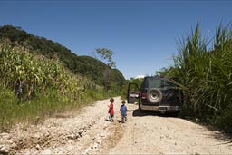 Between corn fields, the road from Guadalupe Tepeyac to Realidad, ran  the van stuck. The boys enjoy the break.