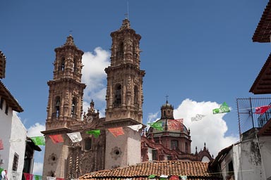 Taxco; Santa Prisca Church over roofs.