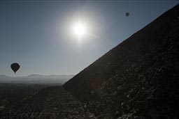 Balloons, sun over Pyramid of the Sun. Teotihuacan, Mexico.