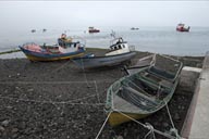 Boats on pebble beach, Hornopiren.