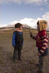 Boys in plain before Cotopaxi, late afternoon, near Laguna.