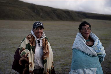 Cold up on Cotopaxi plateau. Indigenas wrapped in ponchos and blankets. Ecuador.