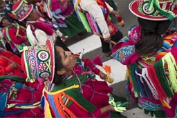 Women from Puno march and dance along parade on plaza de armas, Lima Independence Day in Peru. 