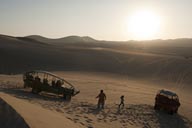 Setting sun, Huacachina, dunes and sand buggies.