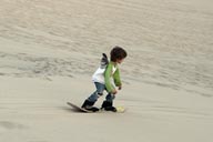 Daniel on sand board, dunes of Huacachina.
