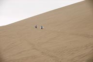 Up a great Huacachina dune, on their own exploring, taking two sand boards with them. When they disappear behind the rim and stay there I go and check.