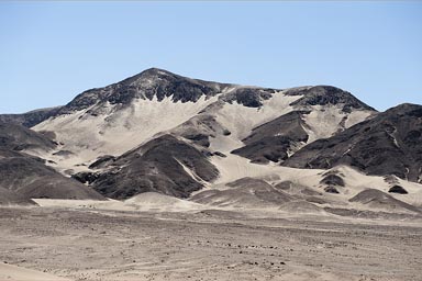 Desert mountain and sand, south from Ica, Peru.