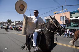 Rider pulls his sombrero hat on Arequipa Day, Peru.
