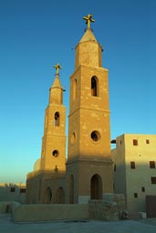 Saint Anthony monastery-church towers, Egypt, evening light.