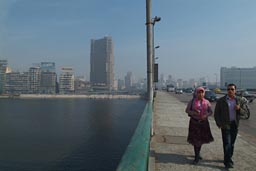 Cairo and smog, couple on bridge.