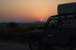 Land Rover, I leave Conakry, Orange sun rising, Guinea, Guinee.