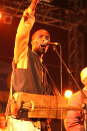 Hassan Boussou raising arm.