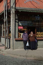 Woman buying bread at bakery. Trabzon, Turkey.