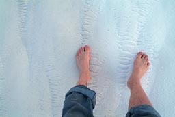 Feet on white chalky soil, Pamukkale.