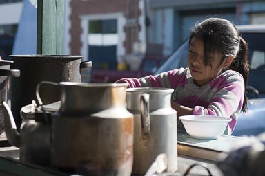 San Marcos, early morning, girl steers in a pot, Street Cafe near central market, Western Highlands Guatemala