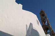 Lindos, orthodox church-Greek flag, white walls.