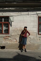 Christina, in Brasov, Romania, in boots and skirt.
