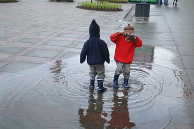 Boys in puddle on Nevsky Prospect.