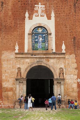 Sunday mass, Ticul in Yucatan, people standing outside church.