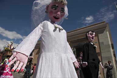 Marriage figures, puppets in a street parade, Oaxaca.