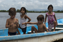 Mexican/Austrian/Moroccan curiosity, the lagoon in Boca del Cielo, Chiapas, a boat, 2 boys, two girls.