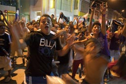 Tumbes, football cup victory celebrations in street at night.