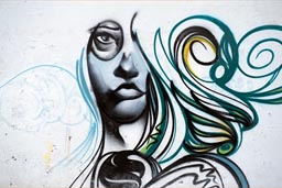 Graffiti in Huanchaco, woman and hair unfinished.