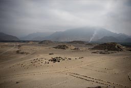 Hazy are all days in desert Peru, along the coast, especially mornings, Caral pyramids 5,000 years old, Peruvian pre-Inca civilization.