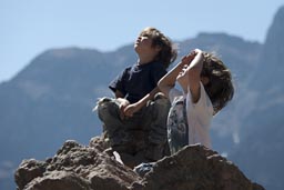 In Colca Canyon my two boys raise their heads and watch the giant Condors glide over. Peru. 
